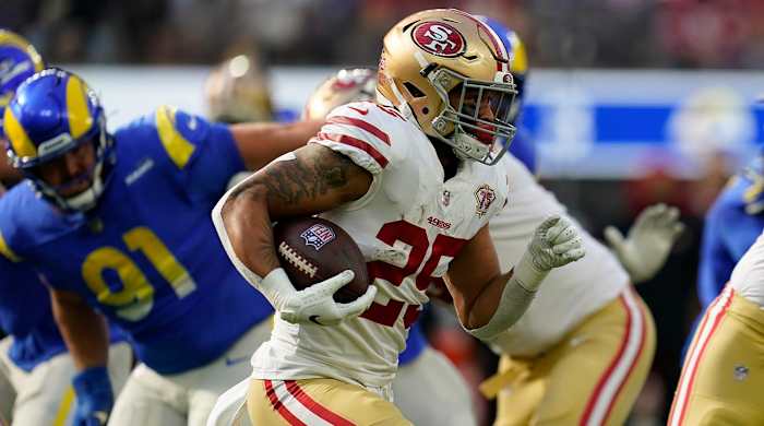 San Francisco 49ers running back Eli Mitchell (25) runs the ball during the first half of an NFL football game against the Los Angeles Rams, Sunday, Jan. 9, 2022, in Inglewood, Calif.